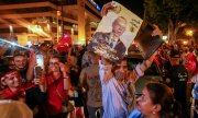 Saied supporters celebrate his election victory on the streets of Tunis on 6 October. (© picture alliance / ZUMAPRESS.com / Hasan Marad)